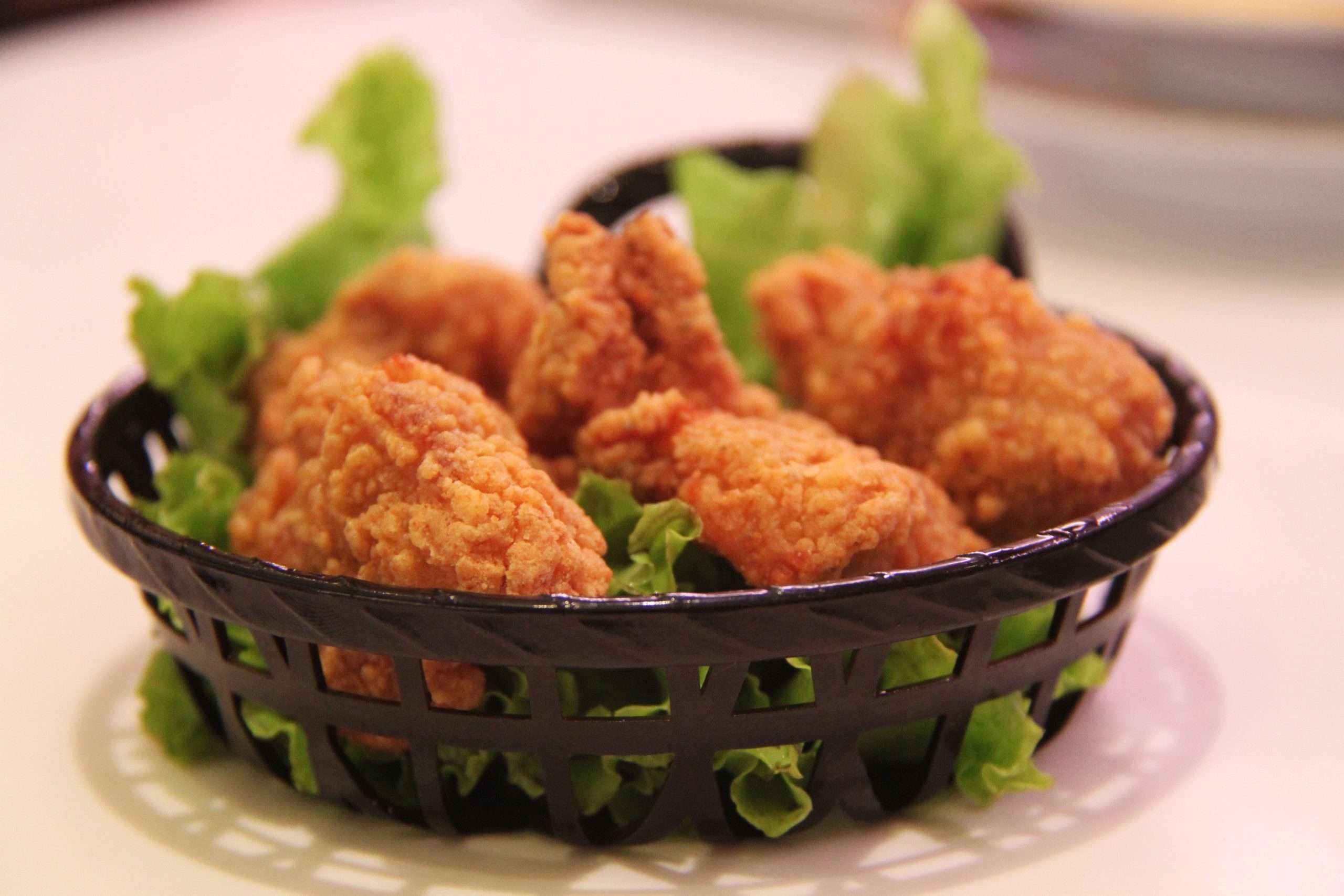 fried chicken in basket made in commercial chicken frying equipment